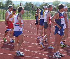 Mike (GB vest) waited to be called to the 1500m start line looking remarkably calm whilst I am unremarkably nervous for him