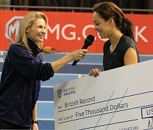 Katarina collecting her cheque for breaking the British Indoor High Jump Record with her jump of 1.96m